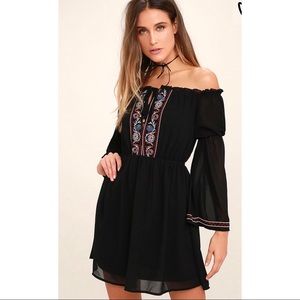 Black embroidered off shoulder dress.